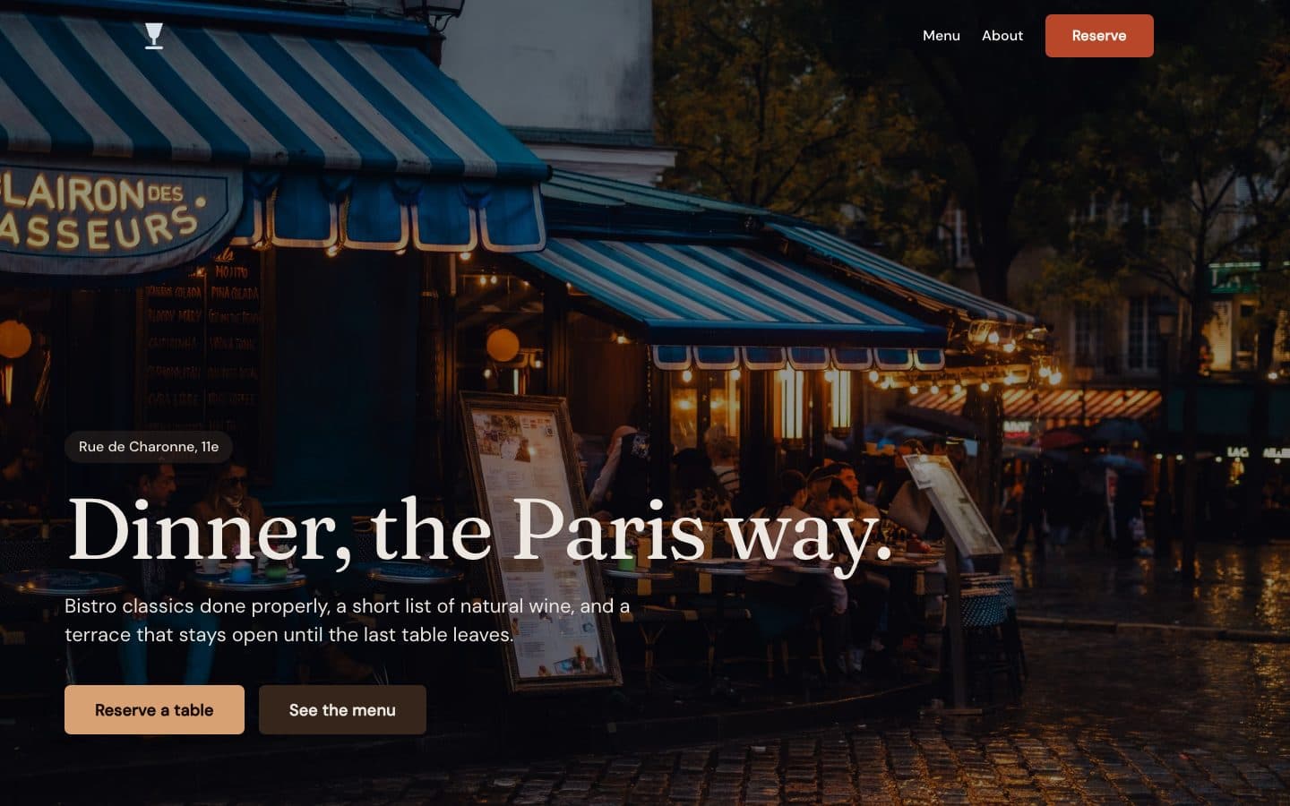 Odette, a Paris bistro site: evening terrace photo behind the headline Dinner, the Paris way